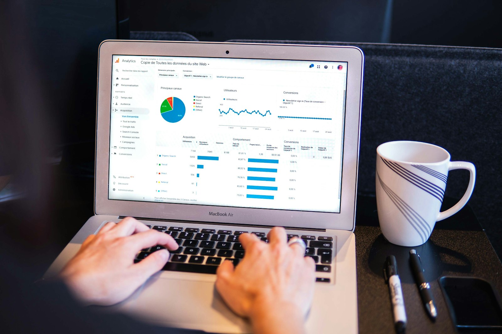 Professional analyzing data on a laptop